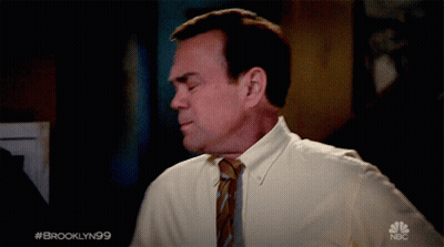 Man In White Shirt And Tie With NBC Logo GIF