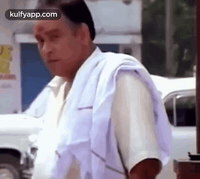 Man In White Shirt And Towel Beside White Car GIF