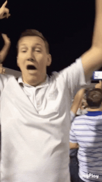 Man In White Shirt Arms In Air GIF