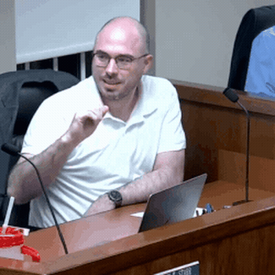 Man In White Shirt At Desk With Laptop And Microphone GIF