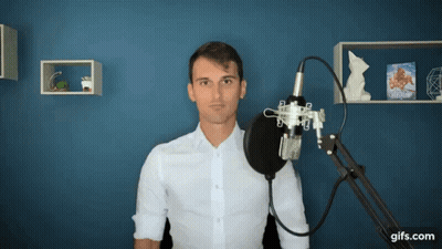 Man In White Shirt At Microphone GIF