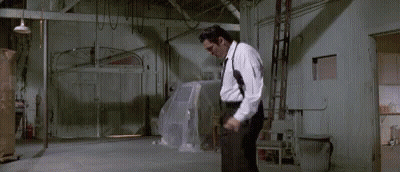 Man In White Shirt Black Pants Holding Gun GIF