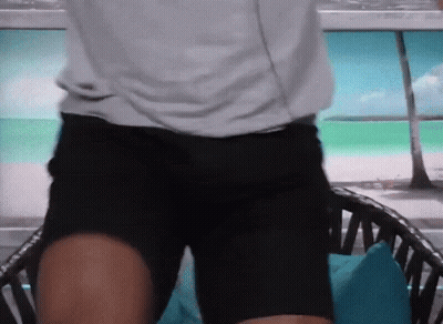 Man In White Shirt Black Shorts Before Chair GIF