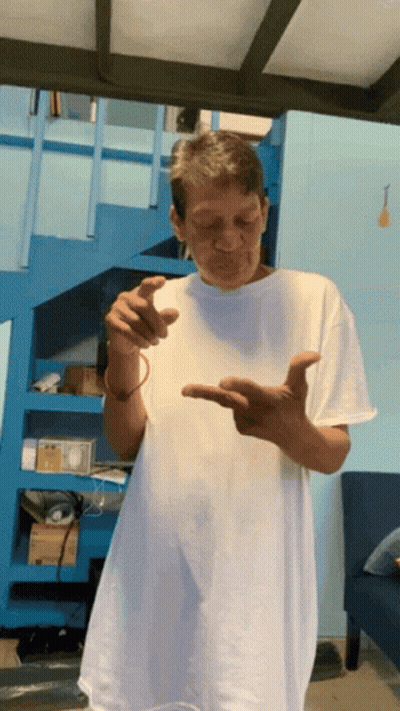Man In White Shirt By Blue Stairs GIF