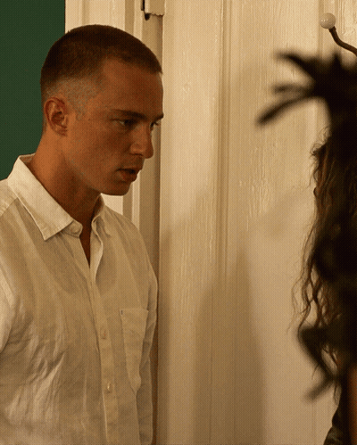 Man In White Shirt By Door GIF