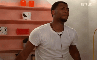 Man In White Shirt By Pink Netflix Shelf GIF