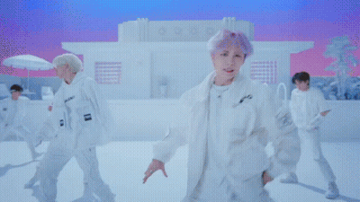 Man In White Shirt By Red And White Wall GIF