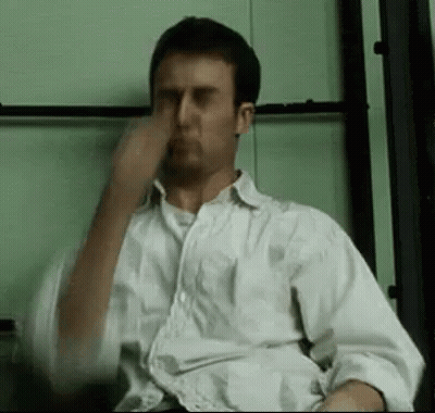 Man In White Shirt Covering Nose GIF