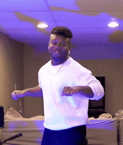 Man In White Shirt Dancing In Blue Light GIF