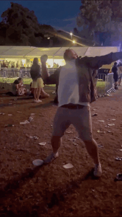 Man In White Shirt Dancing In Dirt GIF