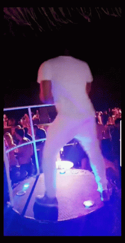 Man In White Shirt Dancing In Front Of Crowd GIF