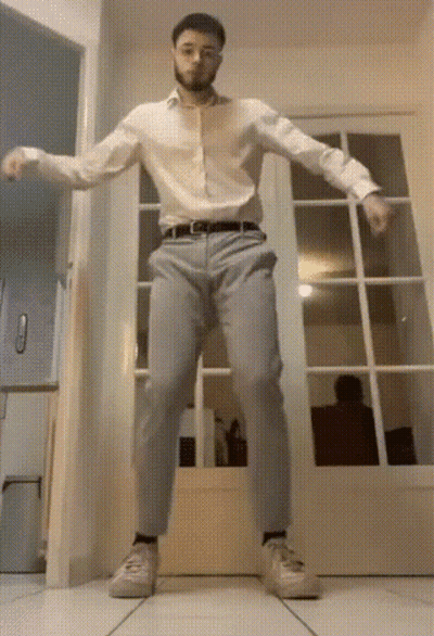 Man In White Shirt Dancing In Hallway GIF
