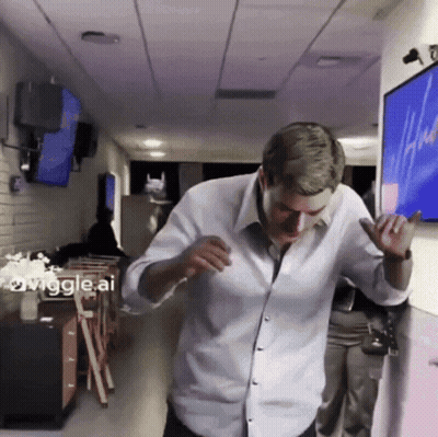 Man In White Shirt Dancing In Hallway Wiggle AI GIF