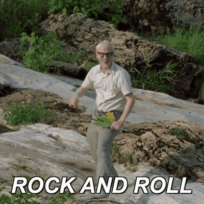 Man In White Shirt Dancing On Rock GIF