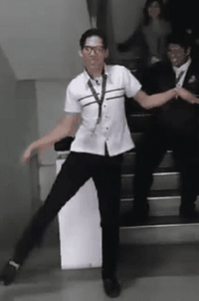 Man In White Shirt Dancing On Stairs GIF