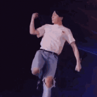Man In White Shirt Dancing With Microphone GIF