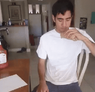 Man In White Shirt Drinking From Bottle GIF