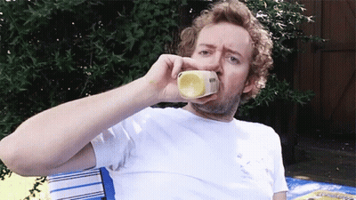 Man In White Shirt Drinking Yellow Container GIF