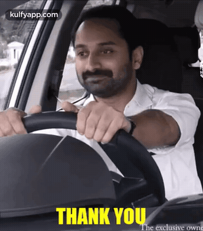 Man In White Shirt Driving Car Saying Thank You GIF