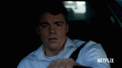 Man In White Shirt Driving Car With Netflix GIF