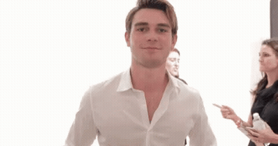 Man In White Shirt Giving Two Thumbs Up With Group GIF