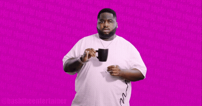 Man In White Shirt Holding Black Mug Says Bashthe Entertainer GIF