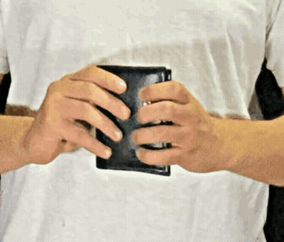 Man In White Shirt Holding Black Wallet GIF