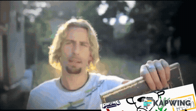 Man In White Shirt Holding Chone Can GIF