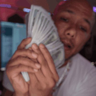 Man In White Shirt Holding Fan Of Money GIF
