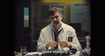 Man In White Shirt Holding Glass GIF