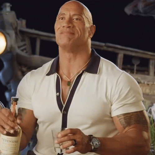 Man In White Shirt Holding Glass And Bottle GIF