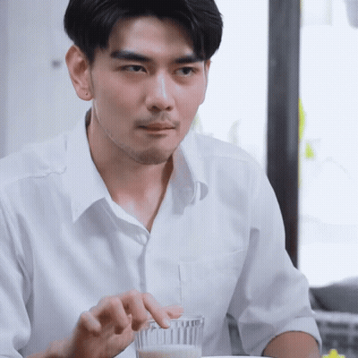 Man In White Shirt Holding Glass Of Milk GIF
