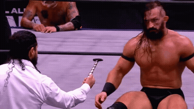 Man In White Shirt Holding Hammer GIF
