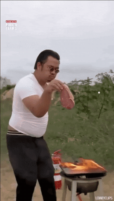 Man In White Shirt Holding Meat GIF