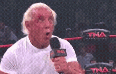 Man In White Shirt Holding Microphone Making Funny Face GIF