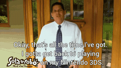Man In White Shirt Holding Nintendo 3DS Game GIF