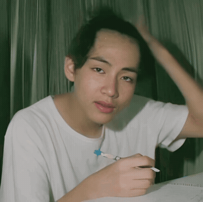 Man In White Shirt Holding Pen GIF