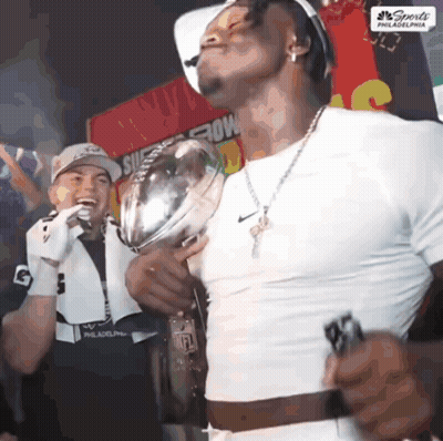 Man In White Shirt Holding Sports Trophy GIF