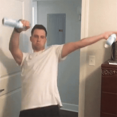 Man In White Shirt Holding Spray Bottle GIF