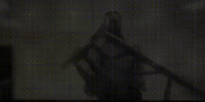 Man In White Shirt Holding Stool GIF