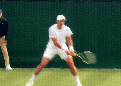 Man In White Shirt Holding Tennis Racket GIF