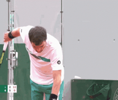 Man In White Shirt Holding Tennis Racquet GIF