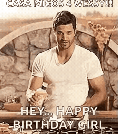 Man In White Shirt Holding Water Bottle By Stone Wall GIF