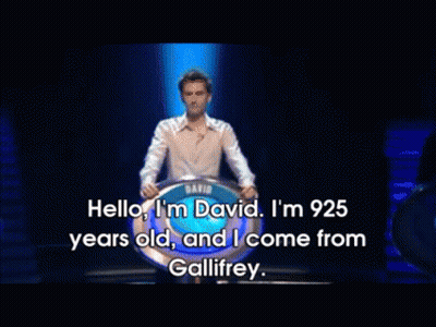 Man In White Shirt In Front Of David Sign GIF