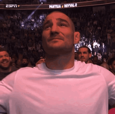 Man In White Shirt In Front Of ESPN Banner GIF