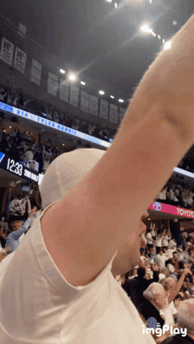 Man In White Shirt In Front Of Toyota Scoreboard GIF