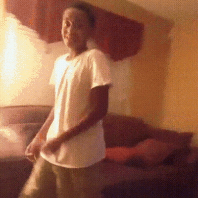 Man In White Shirt In Living Room GIF