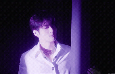 Man In White Shirt In Purple Room GIF