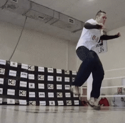 Man In White Shirt Jumping KO Boxing Ring GIF