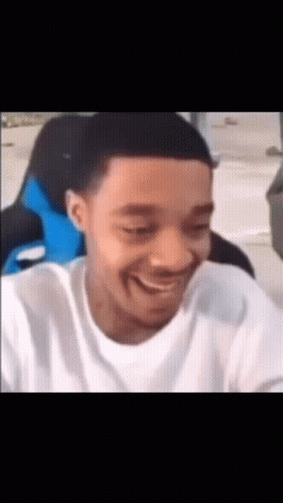 Man In White Shirt Laughing At Camera GIF